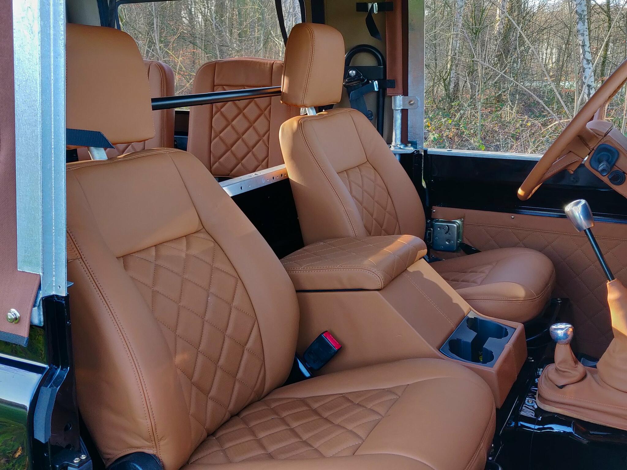 1991 LR LHD Defender 90 Tdi Black A Chestnut Top front seats.jpg